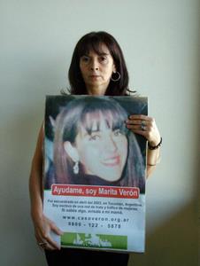 Susana Trimarco holding a missing persons poster for her daughter, Marita Verón. Credit: Courtesy of Metrodelito. 