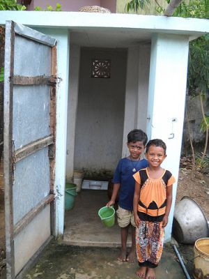 Indian children use a microfinanced facility in their backyard in a Bhubaneswar slum. Credit: Manipadma Jena/IPS