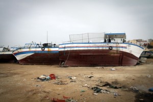 Abandoned migrant boats lie lifeless opposite the port of Lampedusa, Italy, an island which experiences frequent migration from nearby North Africa. Credit: UN Photo/UNHCR/Phil Behan