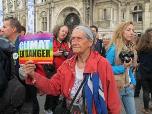 Citizen carrying a succinct CLIMATE IN DANGER warning at the People's Climate March in Paris, Sep. 21, 2014. Credit: A.D. McKenzie/IPS