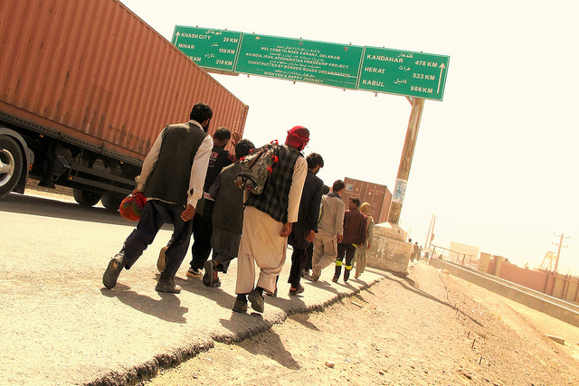 Afghan migrants walk back home after being deported from Iran. Credit: Karlos Zurutuza/IPS