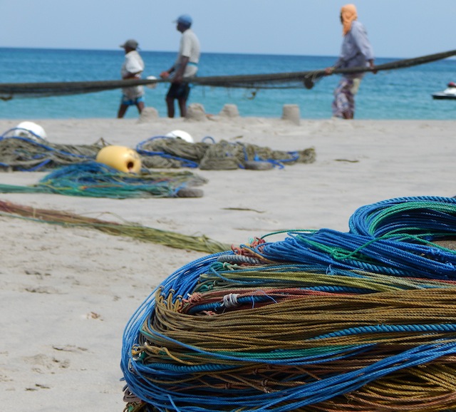 Fishermen haul in their catch on a beach in Sri Lanka's eastern Trincomalee District. Experts say a large portion of marine litter is a by-product of the global fishing industry. Credit: Kanya D'Almeida/IPS