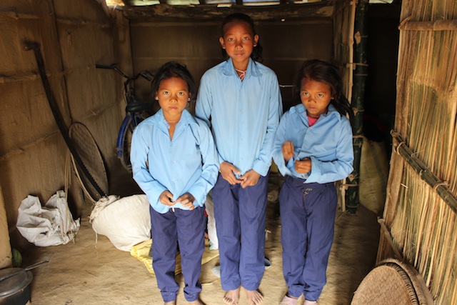 Eleven-year-old Saraswati Chaudhari and her twin sisters Puja and Laxmi are ready for school. Activists say the government must formulate a comprehensive disaster management plan to safeguard families living in disaster-prone areas. Credit: Mallika Aryal/IPS