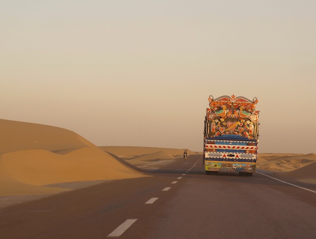 A truck travels down a lost road in Nimroz, the only Afghan province where the Baloch minority form a majority. In the country's remote southwest, Nimroz shares a 500-kilometre border with both Iran and Pakistan. Credit: Karlos Zurutuza/IPS