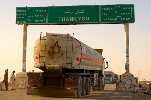 A truck pauses at the Afghan-Iranian border in Zaranj, the administrative capital of Afghanistan's Nimroz Province. Pakistani writer Amhed Rashid tells IPS this province is a smuggling hub through which heroin goes out and weapons come in. Credit: Karlos Zurutuza/IPS