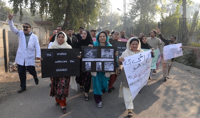 Women hold signs at a rally following the deadly attacks on a public school in the northern Pakistani city of Peshawar, which left 132 students dead. Credit: Ashfaq Yusufzai/IPS