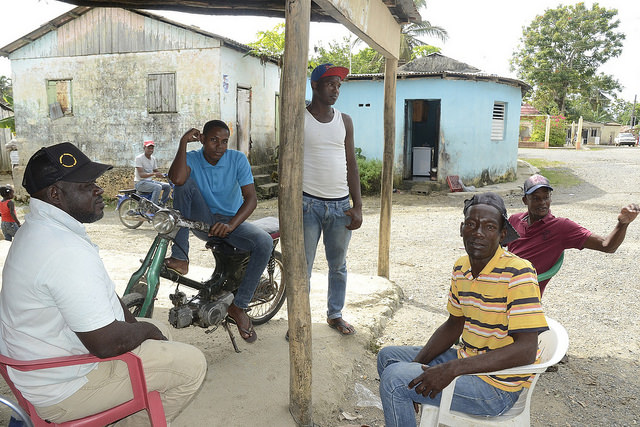 As they chat, local men point to the town, which is mainly populated by people originally from neighbouring Haiti or descendants of Haitians. Credit: Dionny Matos
