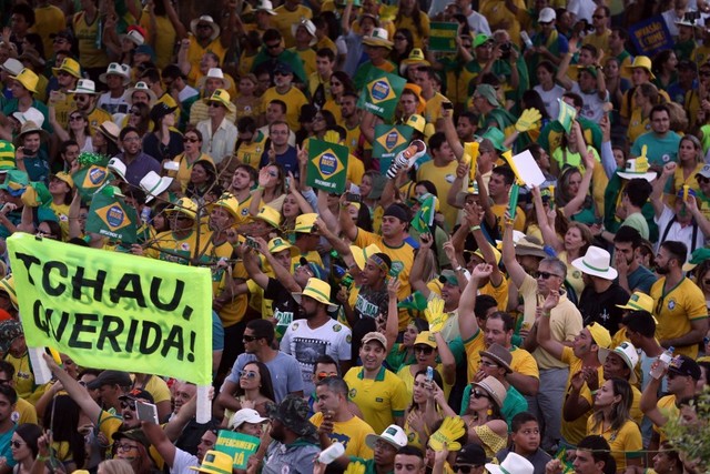 Demonstrators supporting the removal of Brazilian President Dilma Rousseff celebrate Sunday Apr. 17 outside the lower house of Congress in Brasilia after it voted to impeach her. "Chao querida" (Bye-bye dear) reads one of the signs. Credit: Fábio Rodrigues Pozzebom/ Agência Brasil