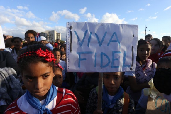 "Viva Fidel" reads a sign carried by a girl during a rally in the Plaza de la Revolución in Havana. After he withdrew from public life, the image of Fidel Castro was still heavily present among every generation in Cuba, including the youngest. Credit: Jorge Luis Baños/IPS