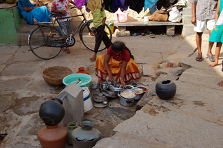 A woman at a public water tank in a Bangalore slum. Credit: Malini Shankar/IPS
