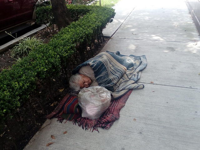 The Sept. 19 earthquake exacerbated the needs of vulnerable groups living in Mexico City, including the homeless, such as this woman sleeping on a sidewalk on the south side of the capital. Authorities have diverted assistance for the homeless to earthquake victims. Credit: Emilio Godoy / IPS