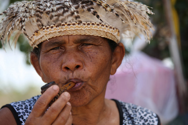 Dorinha Tuxá, a leader of the native Tuxá people, sings to her sacred river and smokes her &amp;quot;marakú&amp;quot;, a pipe with tobacco and ritual herbs, to ask her ancestors to help them get the lands which were promised to them when they were evicted from their island to make way for a dam in northeastern Brazil. Credit: Gonzalo Gaudenzi / IPS