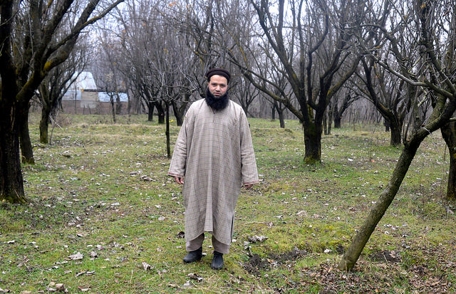 Javaid Ahmad Hurra at his small orchard in central Kashmir's Ganderbal area. Credit: Umer Asif/IPS