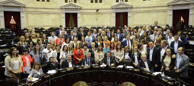 Legislators who supported the new law at four o'clock in the morning on Nov. 23, 2017 took a group photo when the historic session in Argentina's Chamber of Deputies ended, after passing a law that imposes gender parity in political representation. Credit: Chamber of Deputies of Argentina