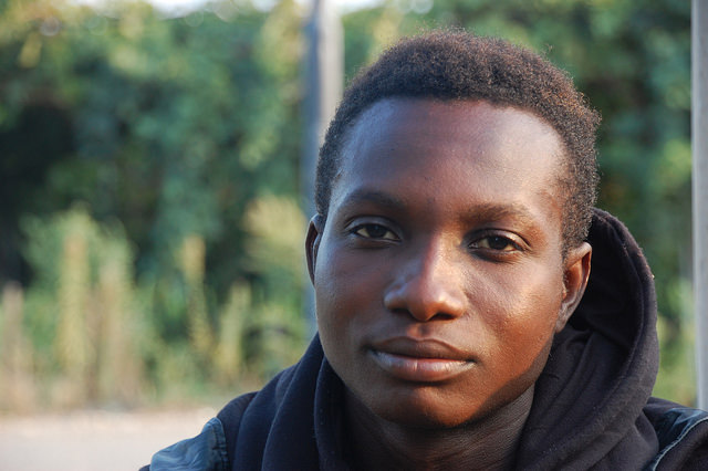 Bismark Asoma, 20, migrated from Ghana to Italy. He lives in an abandoned farm with a dozen other West Africans. Credit: Daan Bauwens/IPS