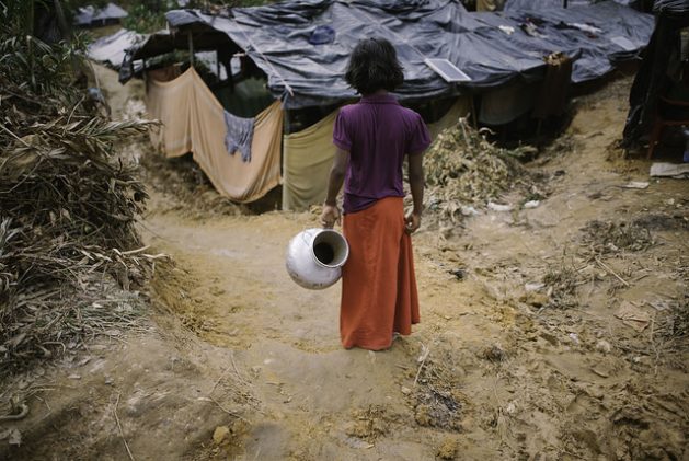 A Rohingya girl goes to fetch water in Balukhali camp, Bangladesh. Credit: Umer Aiman Khan/IPS