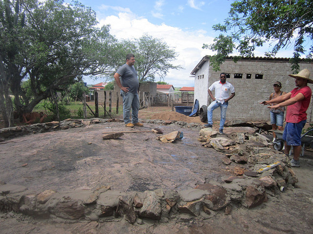 This concrete tank is being built on a large rock on the farm of Normaleide de Oliveira, in the municipality of Pintadas, to be used for fish farming. Stones were used to make the walls using cement, on top of a rock in order to facilitate irrigation by gravity, in an example of agricultural development that optimises the use of the scarce water in the Sertão eco-region in Northeastern Brazil. Credit: Mario Osava / IPS