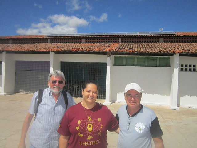 School vice principal Analucia Casimiro (C) and science teacher Clemilson Lacerda (R) pose for a picture with solar power expert Cesar Nóbrega (left) in the yard of the Dione Diniz School, the first public elementary school to have solar energy in Paraíba, the Brazilian state most threatened by desertification. Credit: Mario Osava/IPS