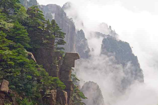 Huangshan or the Yellow Mountain in China's Anhui Province. The natural beauty of rock formations, lush green pine trees and a sea of cloud has inspired countless painters and poets over the ages. Credit: Trevor Page