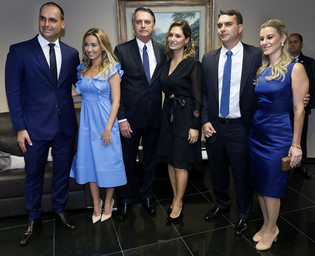Jair Bolsonaro receives the document officially naming him president-elect of Brazil, next to his wife, two of his five children - one of whom is a member of the lower house and the other a senator - and their wives. A staunch defender of the traditional family, his will have a strong presence in his government, which has already begun to spark conflicts and scandals involving some of his offspring. Credit: Roberto Jayme/Ascom/TSE-Fotos Públicas