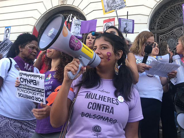 A young woman takes part in a demonstration in the city of Rio de Janeiro, wearing a T-shirt with the message: &amp;quot;Women against (Jair) Bolsonaro&amp;quot;. Women led the fight against the now president of Brazil during the election campaign, with the slogan #ÉlNo (not him). Credit: Fabiana Frayssinet/IPS