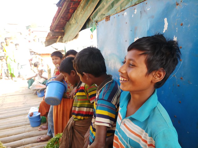 Mohammad Rafique, along with other refugee children, gathered at the Rohingya market of Kutupalong camp to sell vegetables he brought earlier from a local market in this photo dated Mar. 11, 2020. This was two weeks before Bangladesh went into a nationwide lockdown in an attempt to contain the spread of the coronavirus. the pandemic is leading to a global child rights crisis with increases in poverty and hunger, child labour and child marriage, child slavery, child trafficking and children on the move. Credit: Rafiqul Islam/IPS