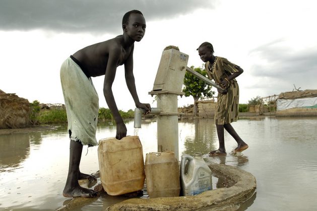 Sudan, the largest country in Africa, is most vulnerable to climate variability and change with drought and flooding being the biggest climate challenges. This dated photo show displaced children fetching water following 2008 floods in Sudan. Courtesy: UN Photo/Tim McKulka