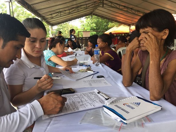 Yukpa Indians from Venezuela register upon arrival at a border post in Colombia. The legalisation and documentation of migrants arranged by the Colombian government allows migrants to access services and exercise rights in the neighbouring country. CREDIT: Johanna Reina/UNHCR