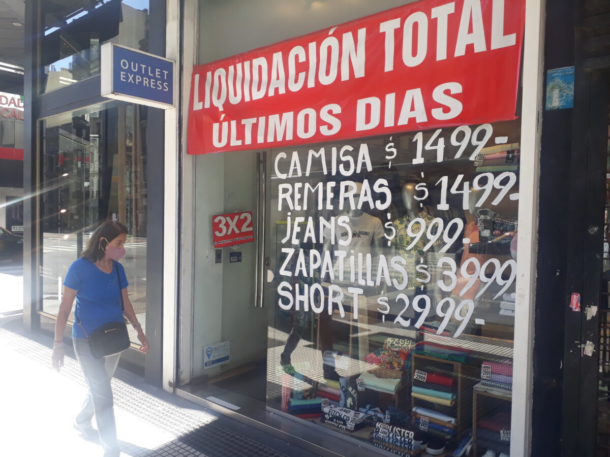 A clothing and footwear store in downtown Buenos Aires tries to attract customers with big sales, despite constantly rising prices in Argentina. CREDIT: Daniel Gutman/IPS