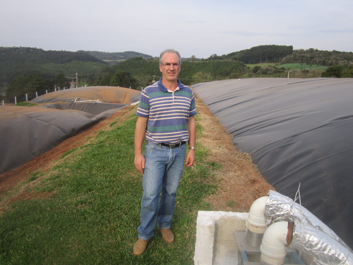Pig farmer Anelio Tomazzoni stands among biodigesters that convert the manure from his 38,000 hogs into biogas, in the southern state of Santa Catarina, Brazil's main pork exporter. Energy production is a new aspect of agriculture and livestock farming in Brazil. CREDIT: Mario Osava/IPS