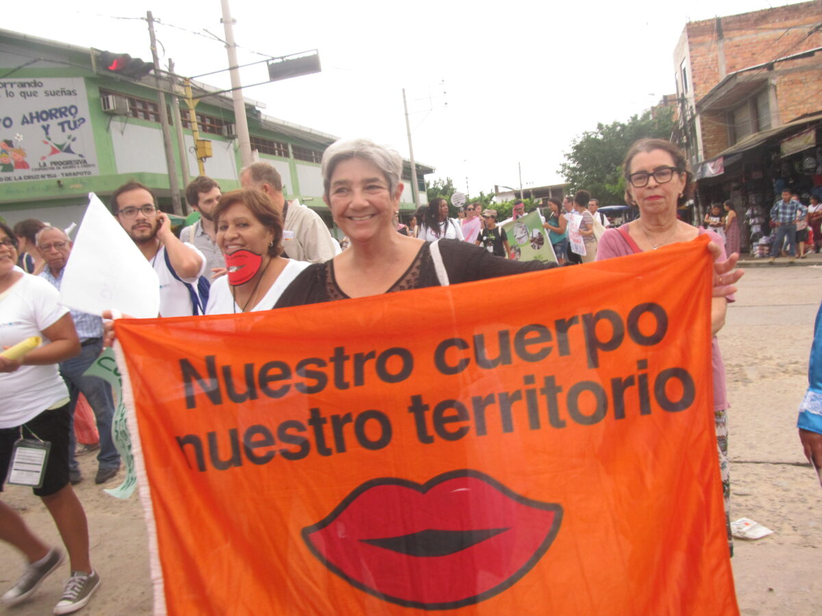 Uruguayan ecofeminist Lilian Celiberti carries a banner reading &amp;quot;Our body, our territory&amp;quot; in the streets of Tarapoto, a city in the central Peruvian jungle, during an edition of the Pan-Amazon Social Forum. CREDIT: Mariela Jara/IPS