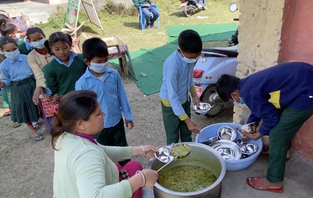 School Feeding - Lunch time at Janajagriti Basic School in Dhangadhi, Nepal.  Credit: Marty Logan
