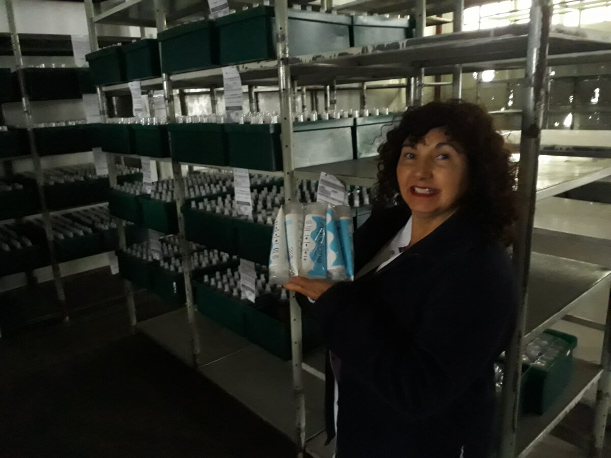 Edith Pereira shows the Aqualane brand moisturizing cream, well known in Argentina, that today is produced by the workers of the Farmacoop cooperative, which has two industrial plants in Buenos Aires, recovered and managed by the workers. CREDIT: Daniel Gutman/IPS