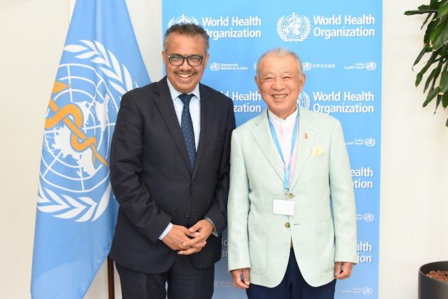 Tedros Adhanom Ghebreyesus, Director-General of the World Health Organization, standing with Yohei Sasakawa, WHO Goodwill Ambassador for Leprosy Elimination, at the 75th World Health Assembly in Geneva, Switzerland in May 2022. Sasakawa was honored at the Global Health Leaders Awards.