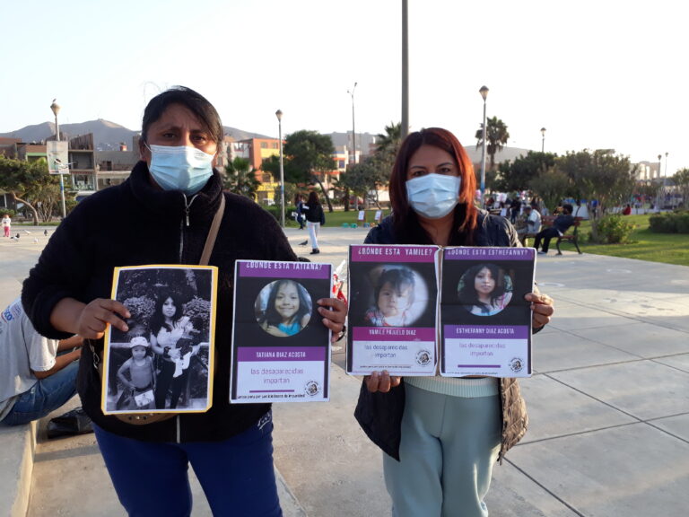 Jenny Pajuelo and Patricia Acosta hold posters of their missing loved ones. Pajuelo is the aunt of Yamile, who was eight months old when she disappeared along with her sister Tatiana and mother Estéfhanny Díaz. Acosta, a mother and grandmother, fights tirelessly for her family members to be found and not to remain on the growing list of missing women and girls in Peru. CREDIT: Mariela Jara/IPS