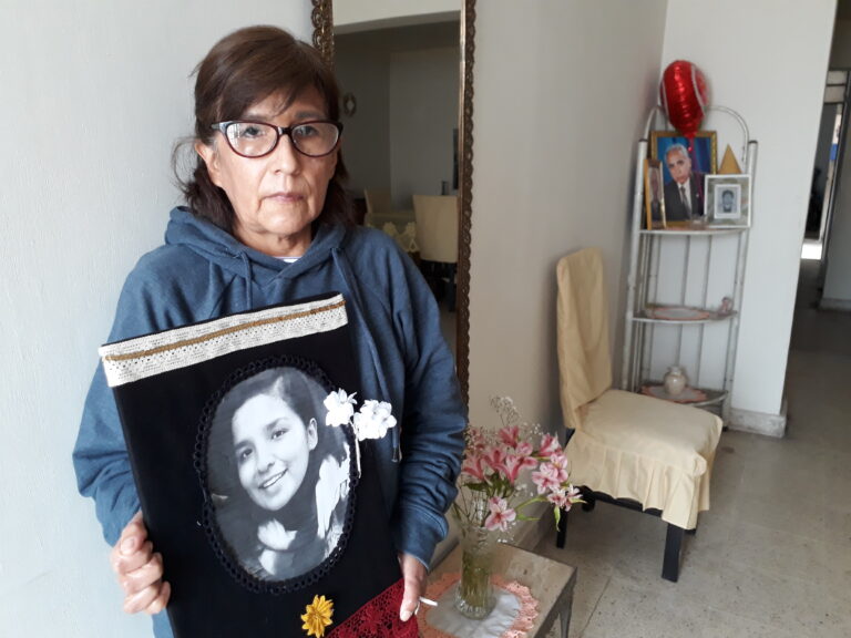In the living room of her home in the San Martin de Porres district of northern Lima, Rosario Aybar shows the photo of her daughter Solsiret Rodriguez, who disappeared in August 2016. Her tireless struggle with support from feminist activists ensured that the case was not shelved, the victim’s remains were found and those guilty of her death were convicted this June. CREDIT: Mariela Jara/IPS