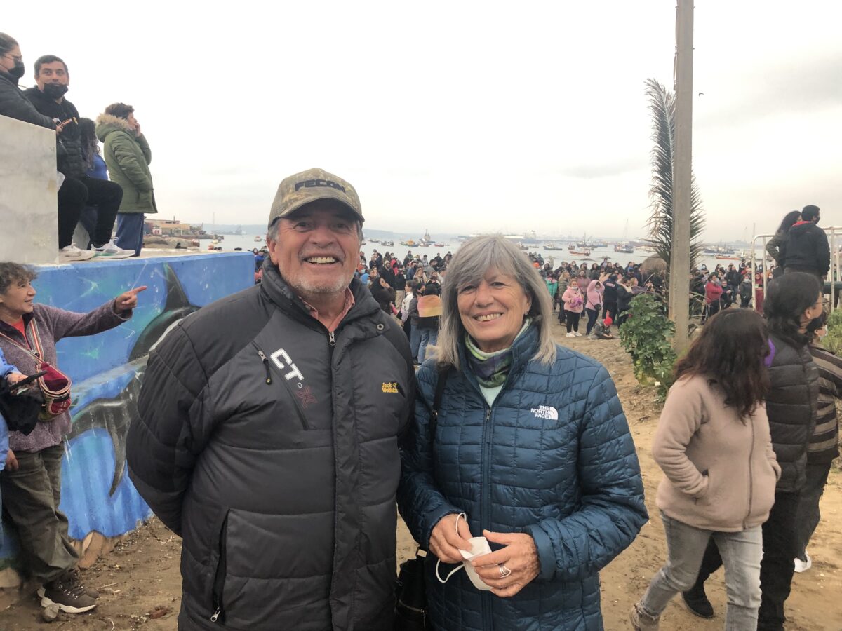 Carlos Vega, a fisherman, diver and trade union leader, and Kata Alonso, spokeswoman for Women of Sacrifice Zones in Resistance, pose for a photo in the bay of Quintero, during the celebrations in that town and in neighboring Puchuncaví for the announcement of the definitive closure of the Ventanas Smelter of the state-owned Codelco copper company, whose polluting emissions have damaged the local environment and made local residents sick for decades. CREDIT: Orlando Milesi / IPS