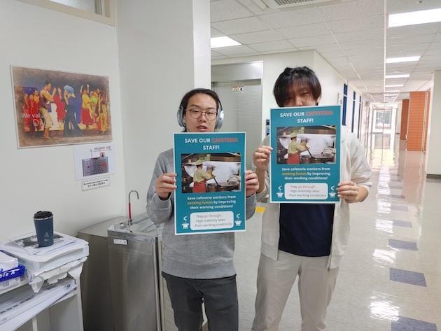 Soo Hyoun Lim (right) and friend campaign for safe working environments for cafeteria workers at Yongsan International School’s cafeteria.