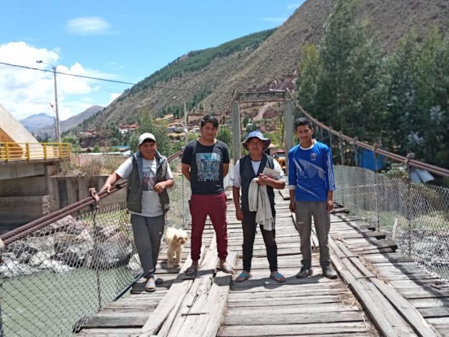 On the suspension bridge that crosses the Vilcanota River, in the village of Secsencalla, in the Andes highlands region of Cuzco, Peru, a group of men who have been taking steps towards a new form of masculinity without machismo pose for a photo. From left to right: Saul Huamán, Rolando Tito, Hilario Quispe and Brian Junior Quispe. CREDIT: Mariela Jara/IPS