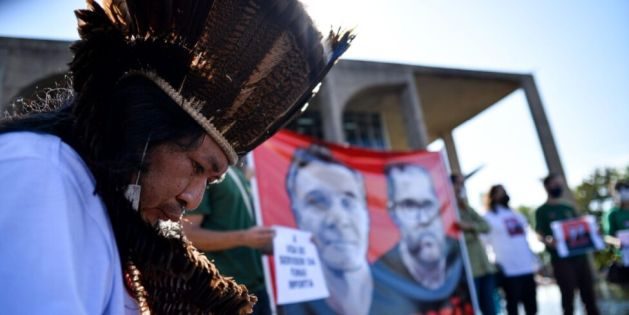 An indigenous protestor demonstrates outside Brazil’s Ministry of Justice in June, following the disappearance of Dom Phillips and Bruno Pereira in the Amazon. Their murders drew global attention to the dangers environmental defenders face in the region (Image: Antonio Molina / Foto Arena / Alamy)