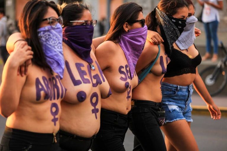 Peruvian activists go topless to demand the right to legal abortion, during a demonstration in the streets of the capital on Mar. 8, 2018. CREDIT: Mariela Jara/IPS