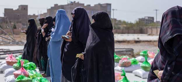 Women receive food rations at a food distribution site in Herat, Afghanistan. Credit: UNICEF/Sayed Bidel