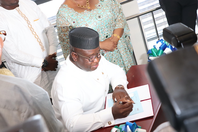 Sierra Leone’s President Julius Maada Bio signing the Gender Equality and Women Empowerment Bill into law. Credit: Francis Kokutse/IPS