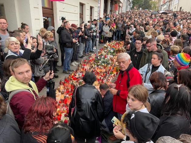 People lay flowers and candles outside the Teplaren LGBTQI bar in Bratislava, Slovakia, following an attack outside the popular a meeting place for members of the city's LGBTQI community in which two people were killed, and a third seriously injured. Credit: Zuzana Thullnerova/IPS
