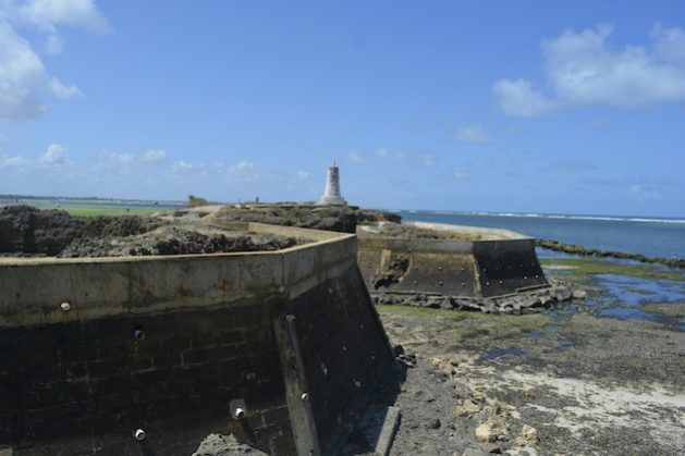The sea wall was built to protect the Vasco da Gama pillar in Malindi. Historical sites along Kenya’s coastline are being threatened by climate-change-induced weather conditions. Credit: Diana Wanyonyi/IPS