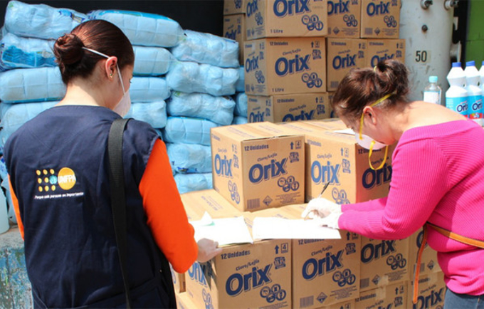 United Nations Population Fund workers prepare packages of menstrual hygiene items for women from poor communities in Central America. The cost of some of these products makes them unaffordable for many families. CREDIT: UNFPA
