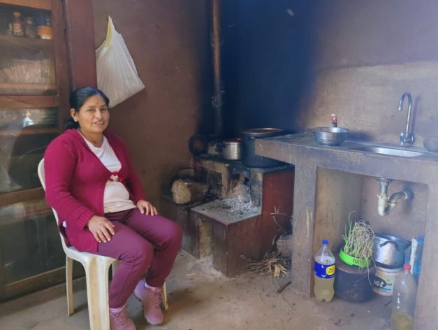 Martina Santa Cruz, a peasant farmer from the village of Sacllo in the southern Peruvian Andes highlands department of Cuzco, is pleased with her remodeled kitchen where a skylight was created to let in sunlight and a chimney has been installed to extract smoke from the stove where she cooks most of the family meals. She is disappointed because a wall was stained black when she recently left something on the fire for too long. But her husband is about to paint it, because they like to keep everything clean and tidy. CREDIT: Janet Nina/IPS - Adopting a healthy housing approach is improving the living conditions of rural Peruvian women like Martina Santa Cruz, a 34-year-old farmer who lives with her husband and two children in the village of Sacllo, 2,959 meters above sea level in the Andes highlands municipality of Calca