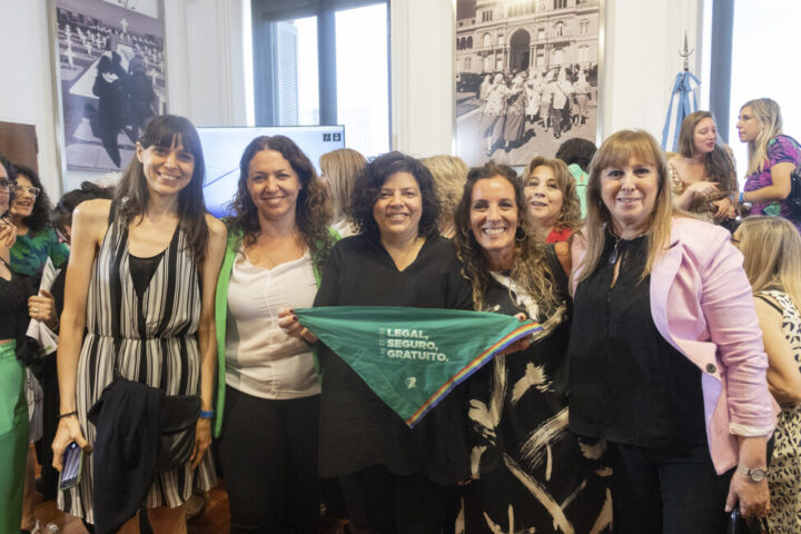 Argentina's Minister of Health Carla Vizzotti (C) holds the green headscarf that is the symbol for the feminist movement that fought for the successful legalization of abortion in Argentina. CREDIT: Ministry of Health