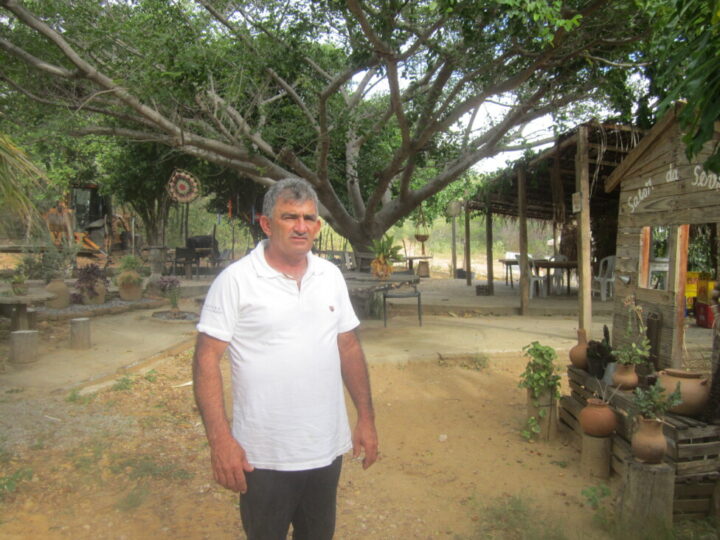 Severino Olegario, a small farmer impoverished by a plague that destroyed the local cotton crop, took advantage of the arrival of the wind towers on his family's mountainous land to become the owner of an open-air restaurant, now a tourist attraction in the municipality of Santa Luzia, in the Northeastern Brazilian state of Paraíba. CREDIT: Mario Osava / IPS