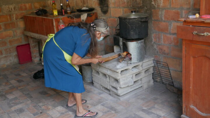 A resident of the coastal hamlet of El Salamar, in the municipality of San Luis La Herradura in southern El Salvador, cooks pasta for lasagna on an ecological stove called a &quot;rocket&quot;, which is much more efficient in producing heat and emits less smoke. This kind of stove has been used for decades in rural communities in the country, with good results in alleviating the health risks posed by wood stoves. But they have not become widespread, due to a lack of government investment and campaigns to encourage their use. CREDIT: Edgardo Ayala / IPS